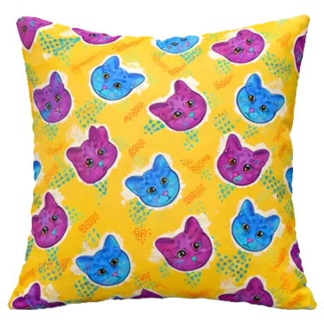 Yellow pillow covered in purple and blue cat faces